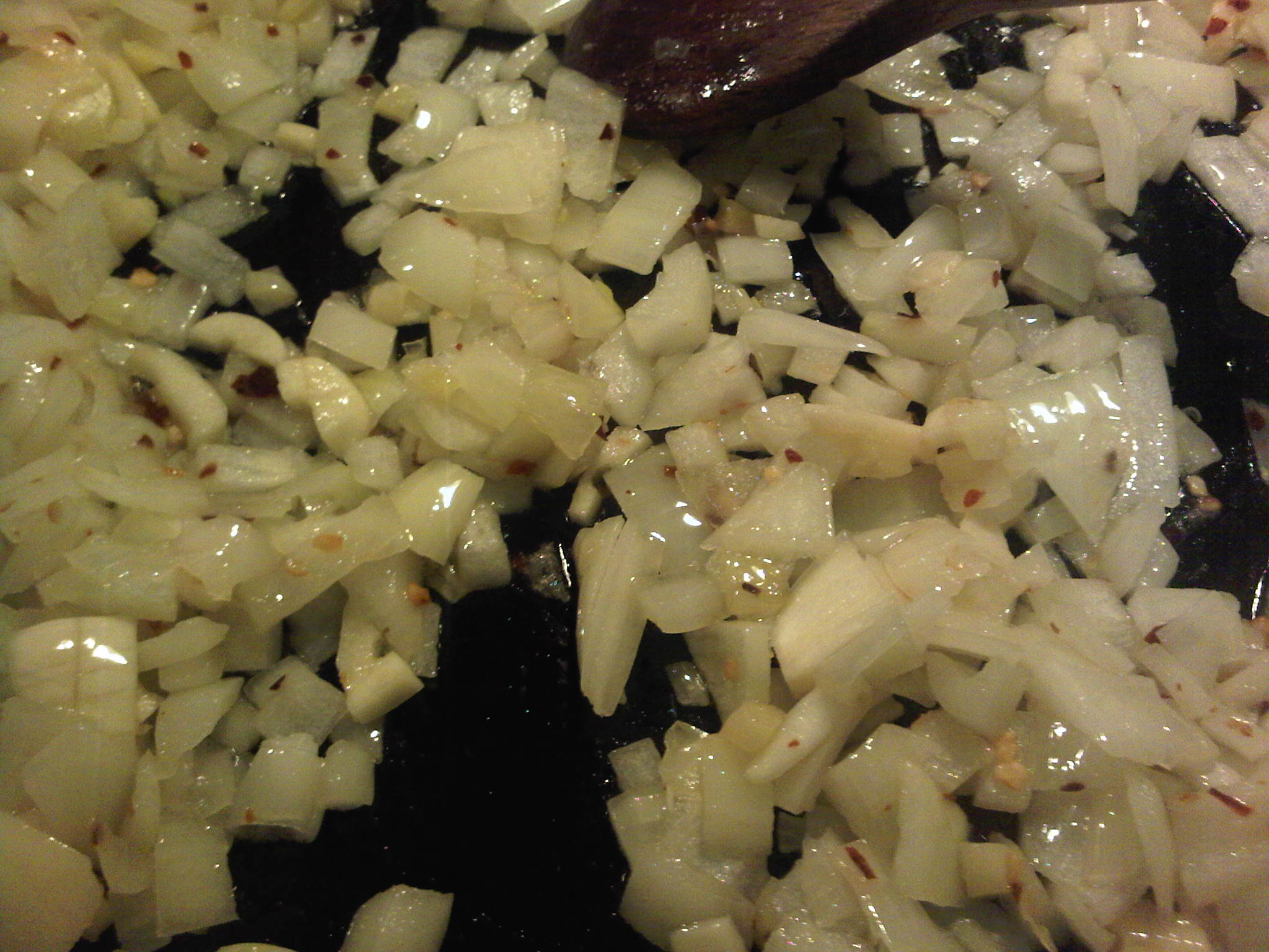 Frying onions, garlic and ginger in oil