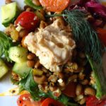 Salad with Curried Black Eyed Peas: tomatoes, cucumbers, feta, walnuts, hummus & balsamic-honey vinaigrette