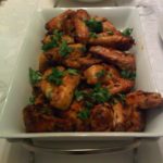 Curried glatt chicken wings coated in a sweet and spicy coconut-curry glaze