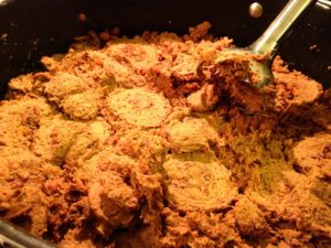 Slow cooking beef, lentils and spices to make shammi kebabs