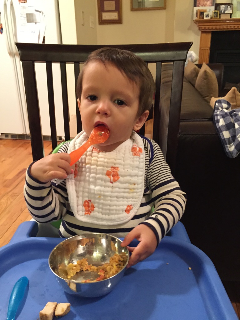 My son eating nine vegetable curry