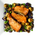 Weeknight Dinner Saver: Salmon Tikka over oven-roasted Honey Gold baby potatoes, purple cauliflower, and green peas