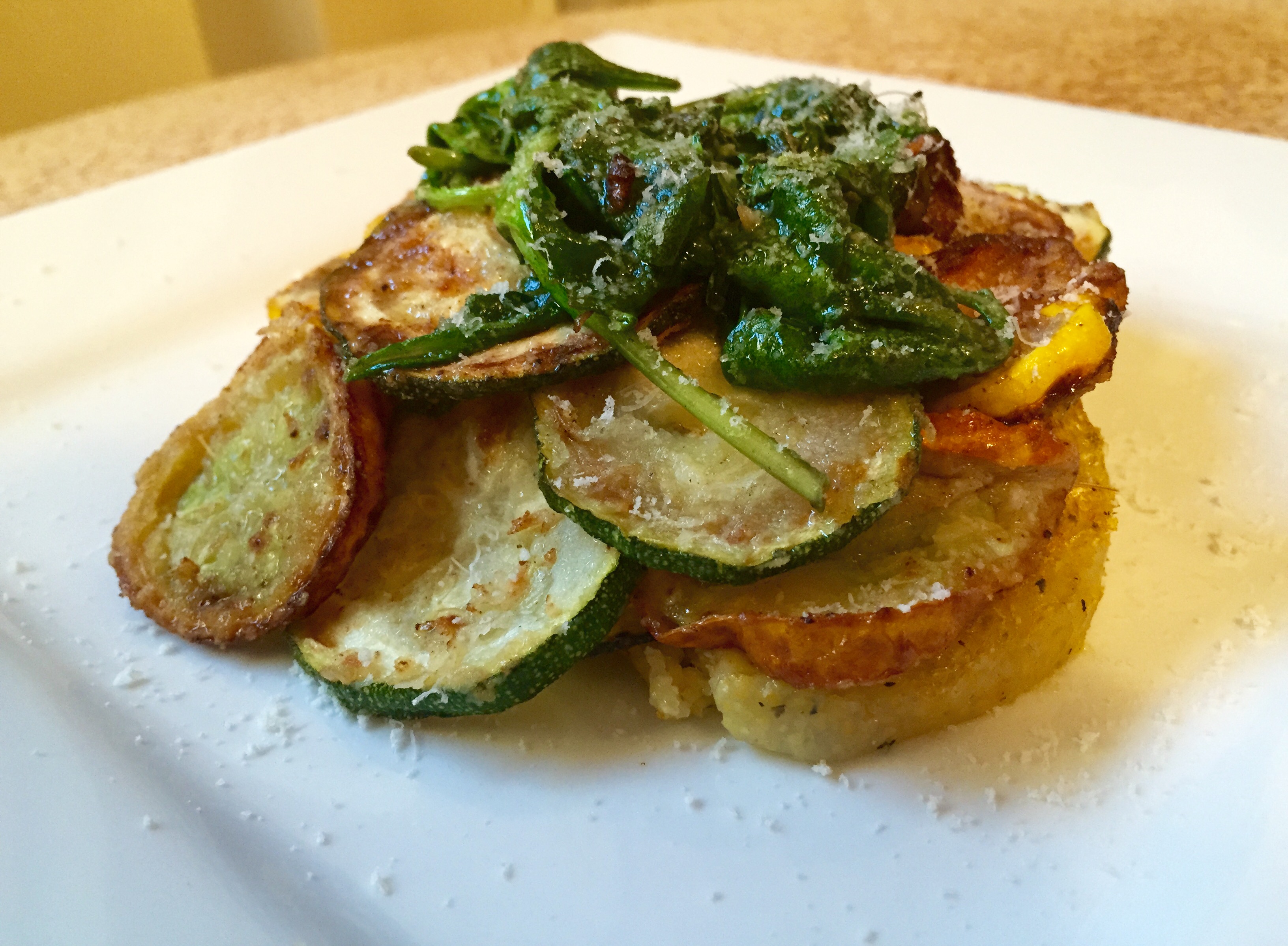 Fried Zucchini with Parmesan Polenta and Crispy Baby Spinach