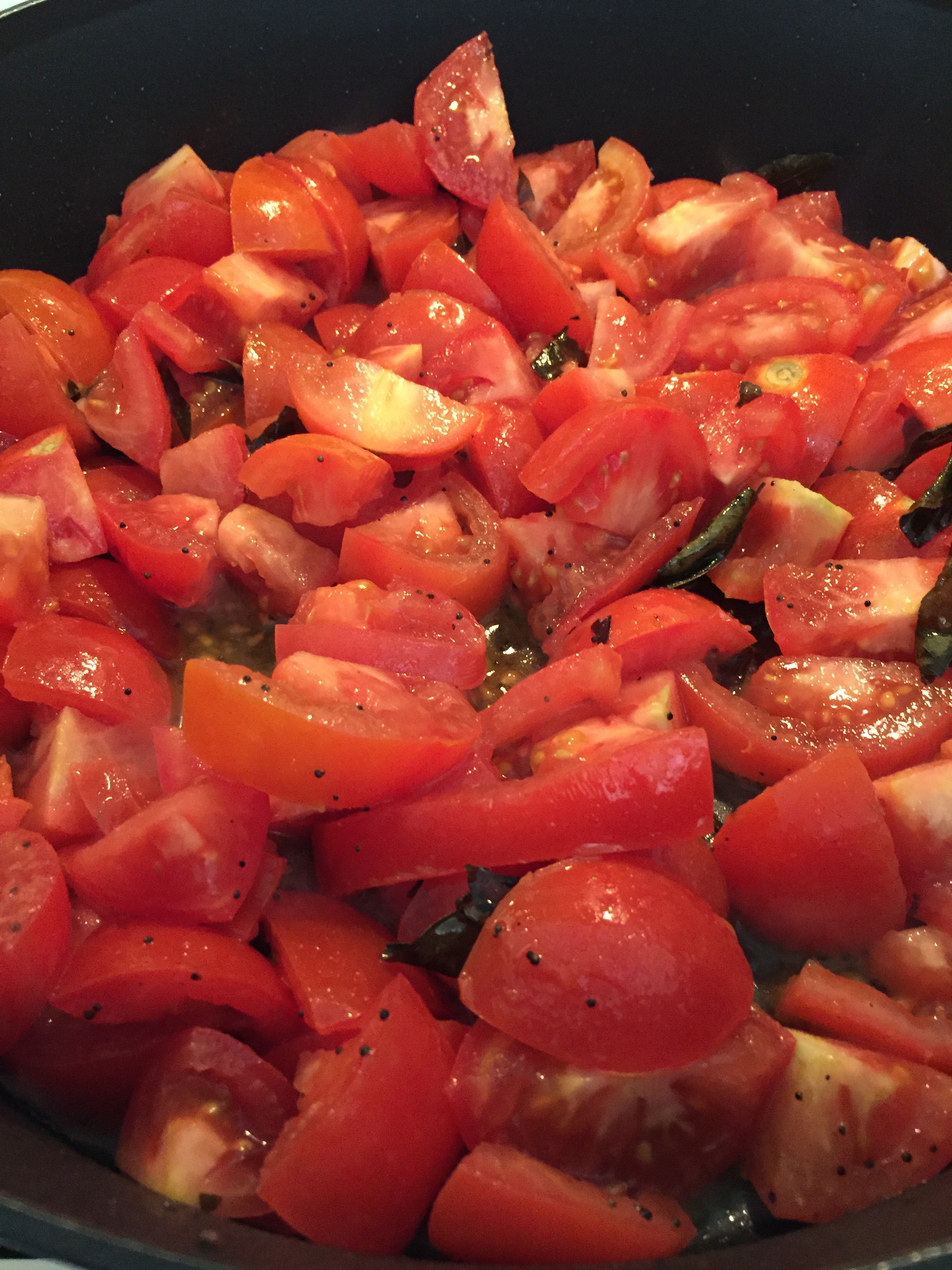 Cooking down tomatoes for chutney