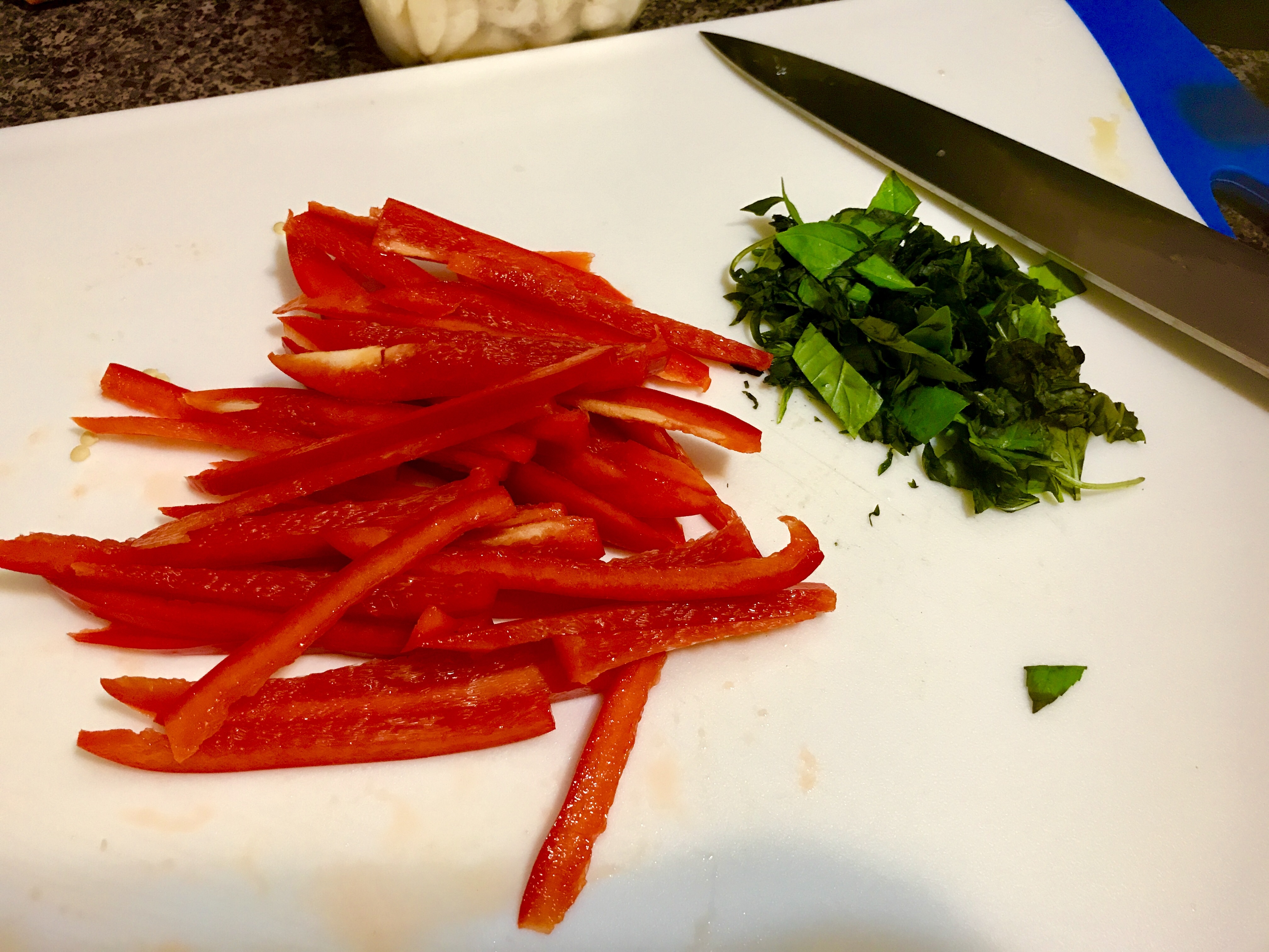 Thinly sliced red bell pepper and chopped baby spinach