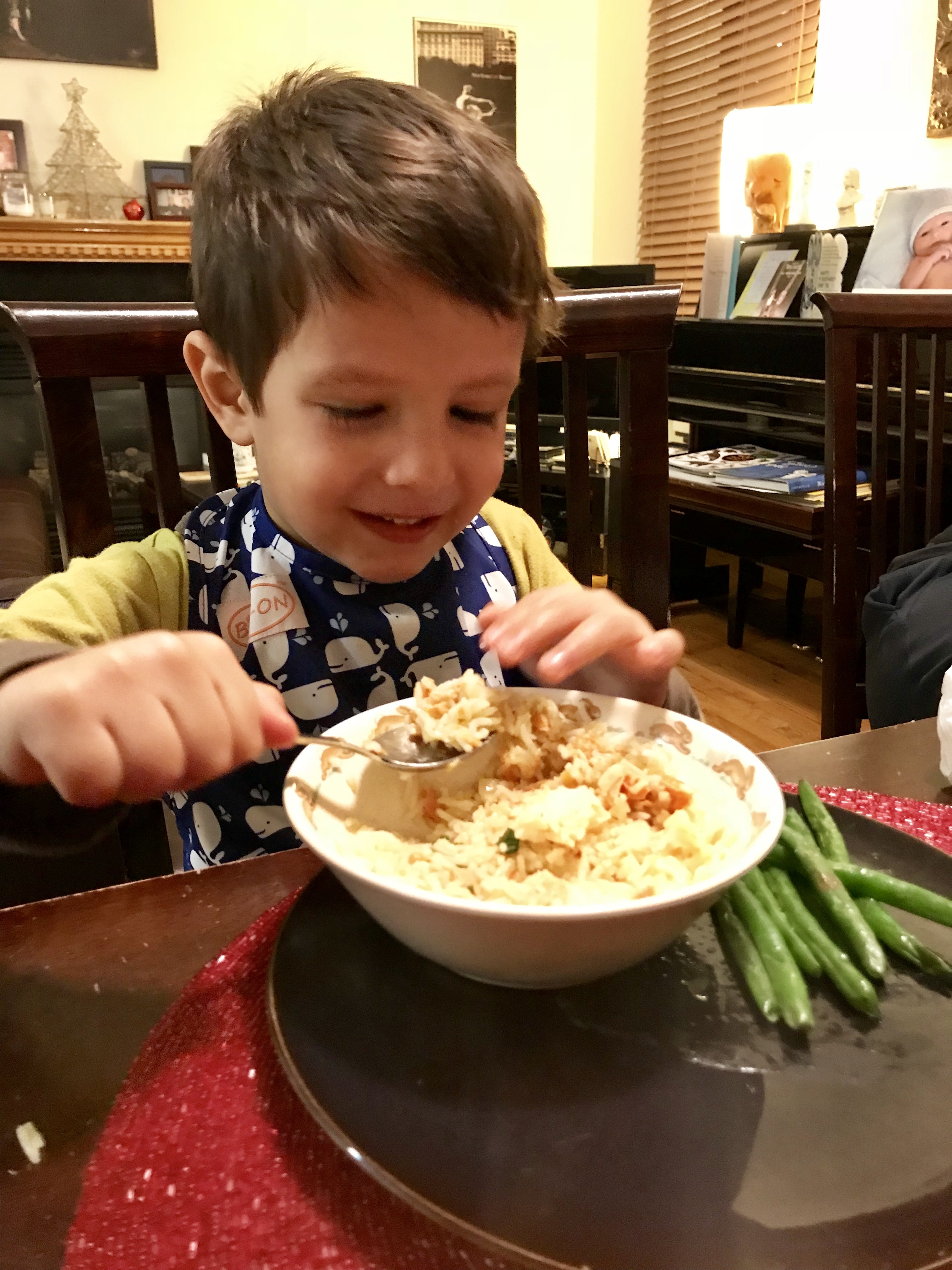 Toddler eating Coconut-Curry Salmon